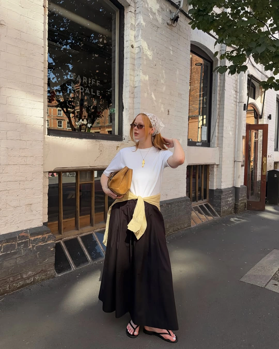 September fashion trends 2026 White Tee With Black Maxi Skirt And Sweater Tie