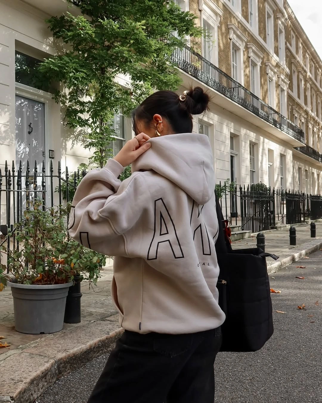 September fashion trends 2026 Oversized Letter Hoodie With Black Trousers
