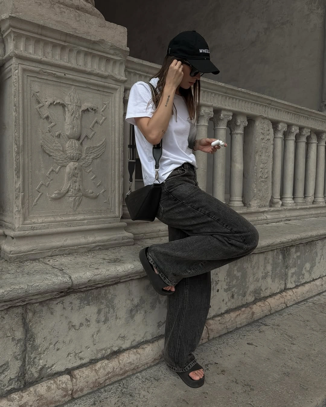 September fashion trends 2026 White Tee With Dark Textured Pants And Cap