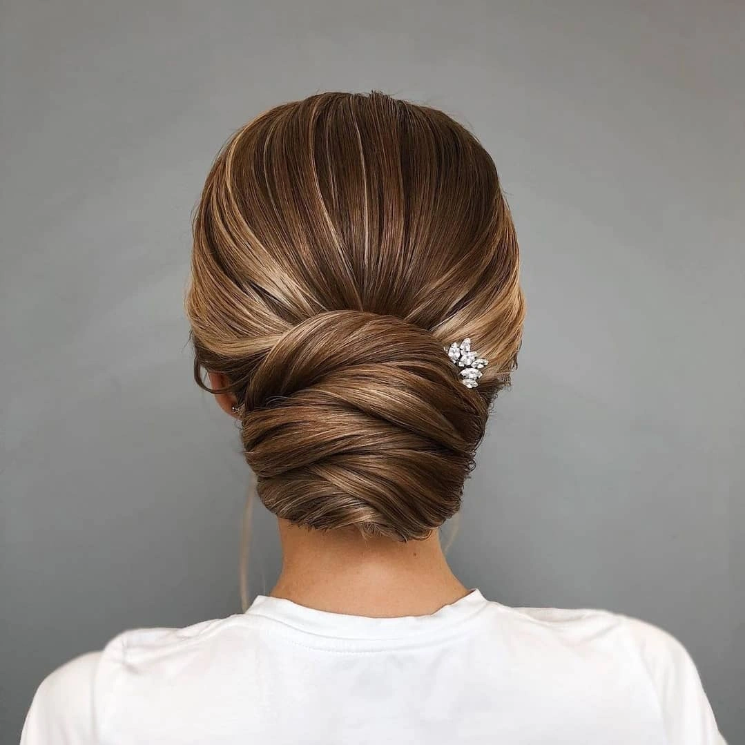 September hairstyles ideas 2026 Smooth Twisted Low Bun From The Back