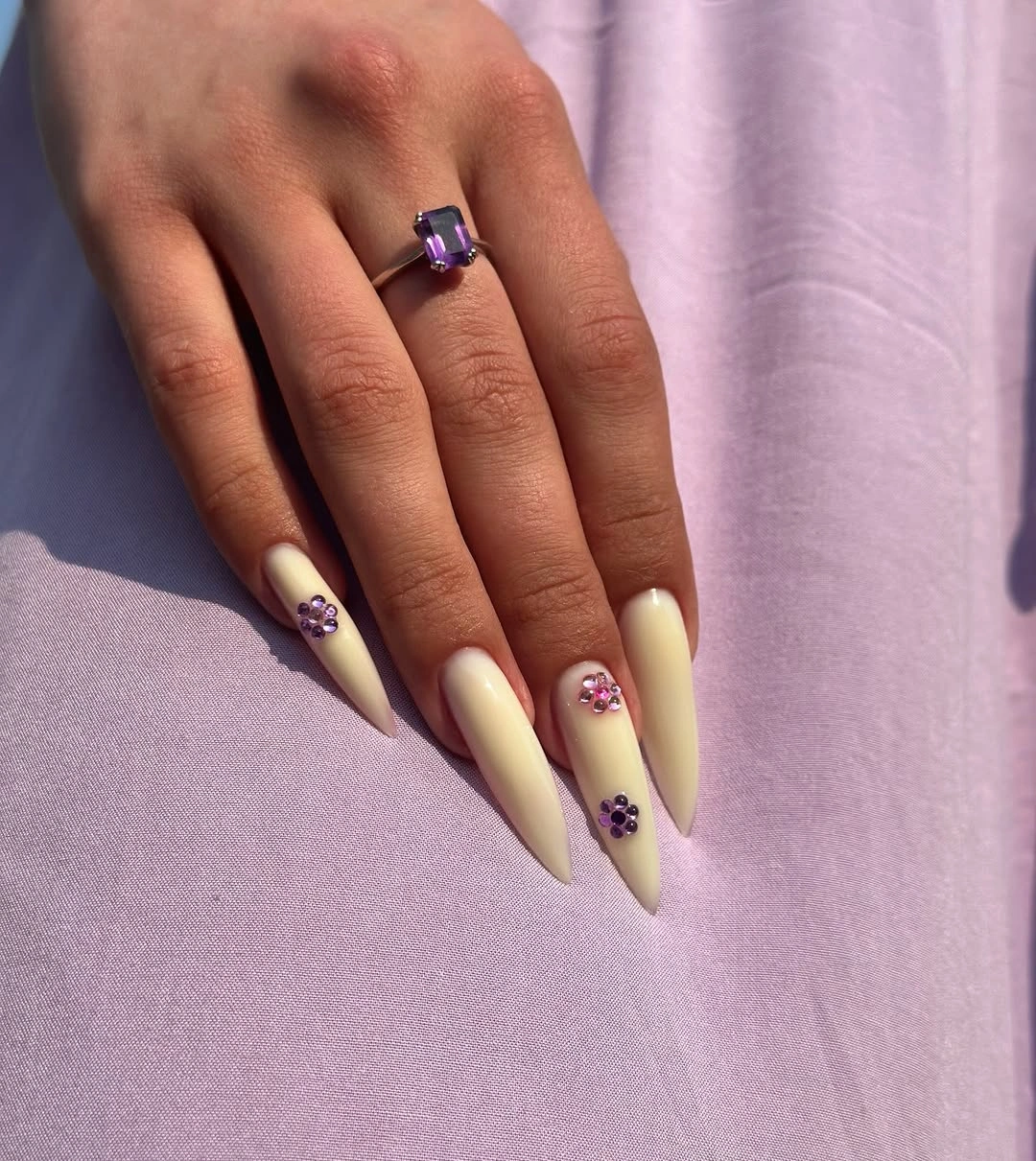 September nail art ideas 2026 Pale Yellow Stiletto Nails With Purple Flowers