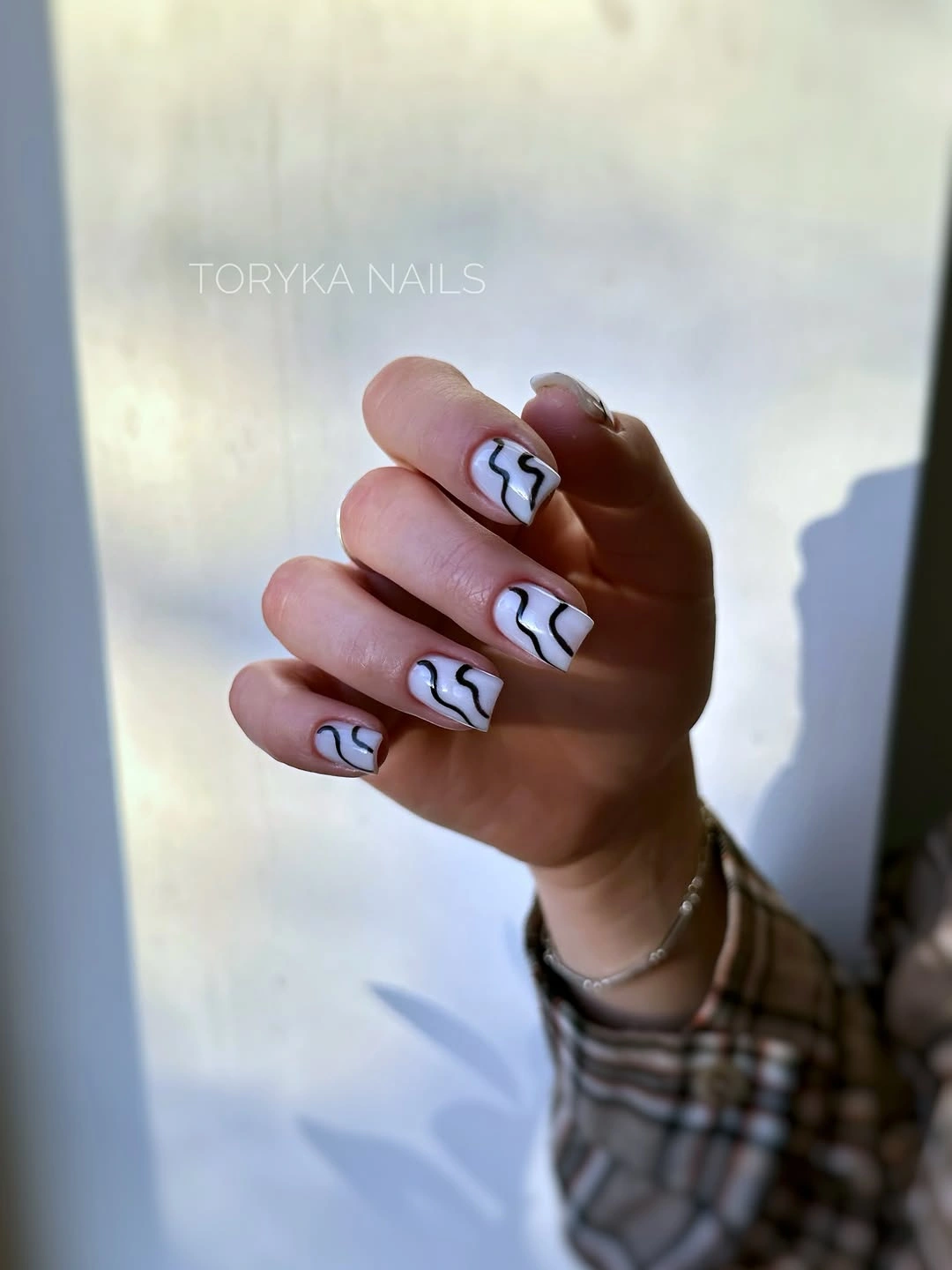 September nail art ideas 2026 White Nails With Black Wavy Line Art