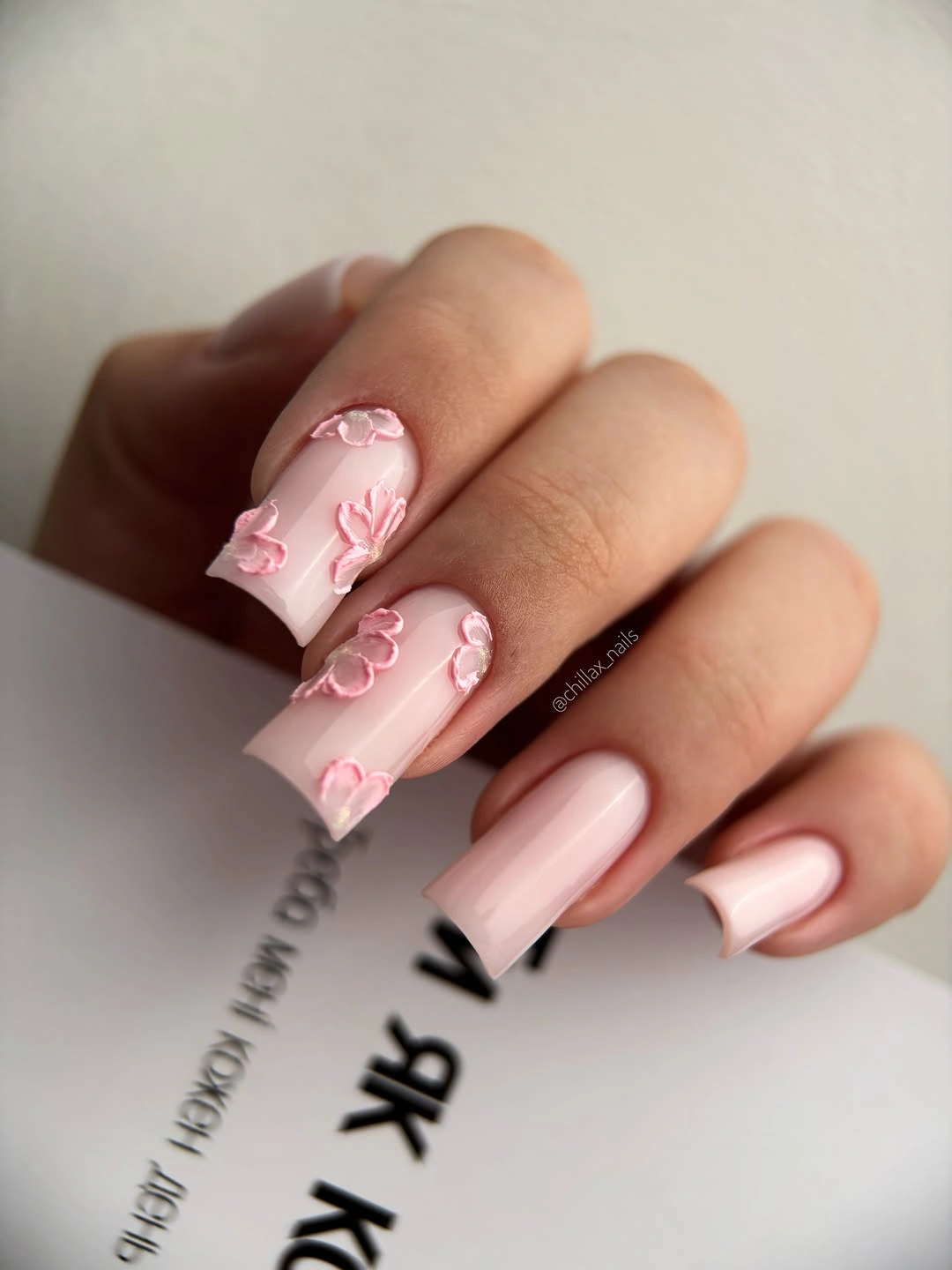 September nail art ideas 2026 Pink Almond Nails With Red Bow-Like Line Art