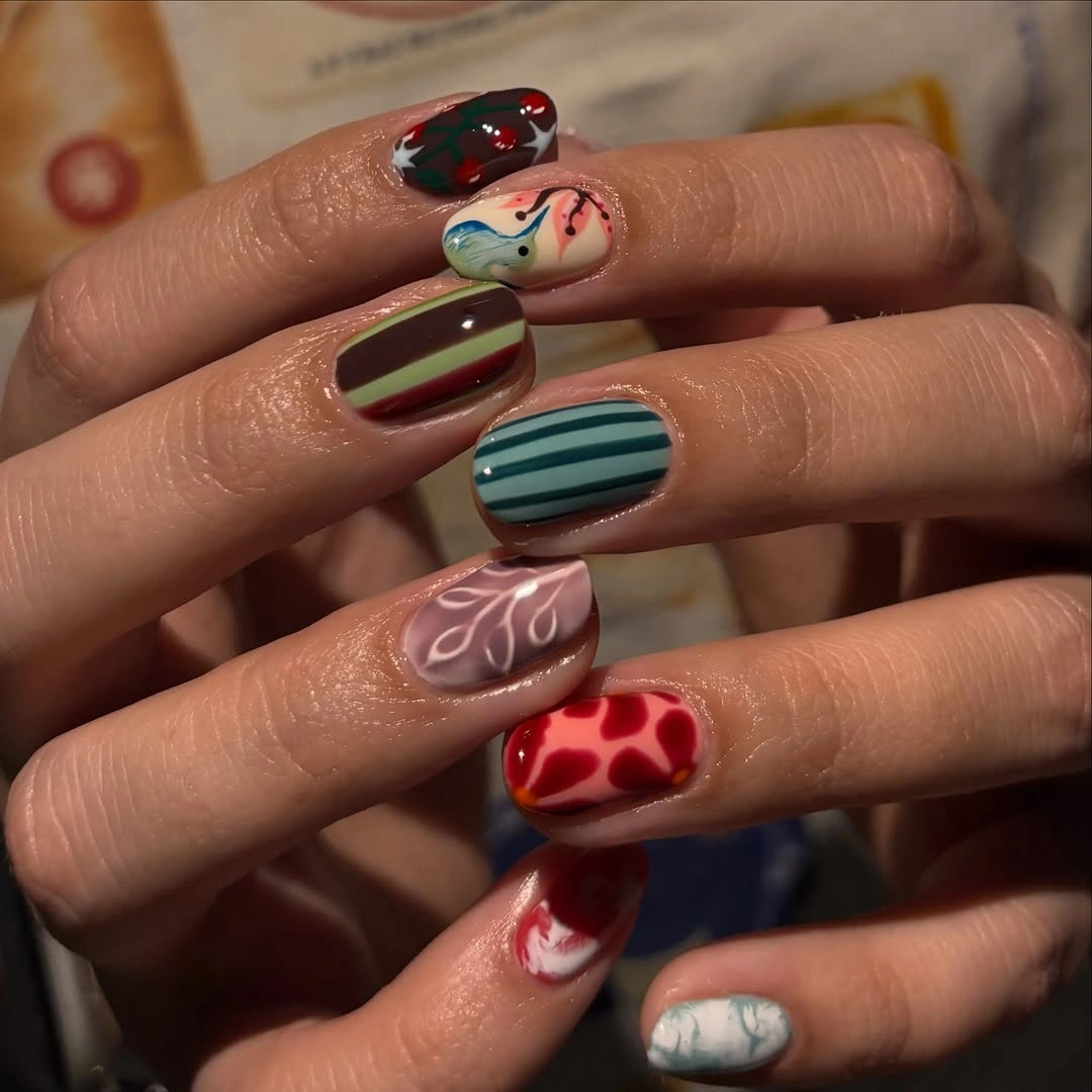 September nail designs 2026 Mismatched Graphic Nails With Hearts And Stripes