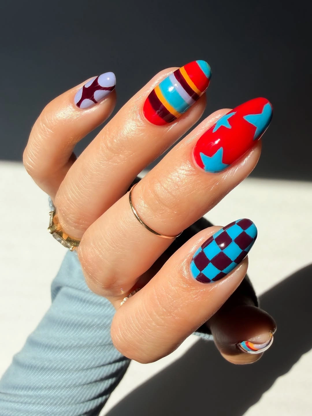 September nail designs 2026 Pop Art Almond Nails With Checkerboard And Stars