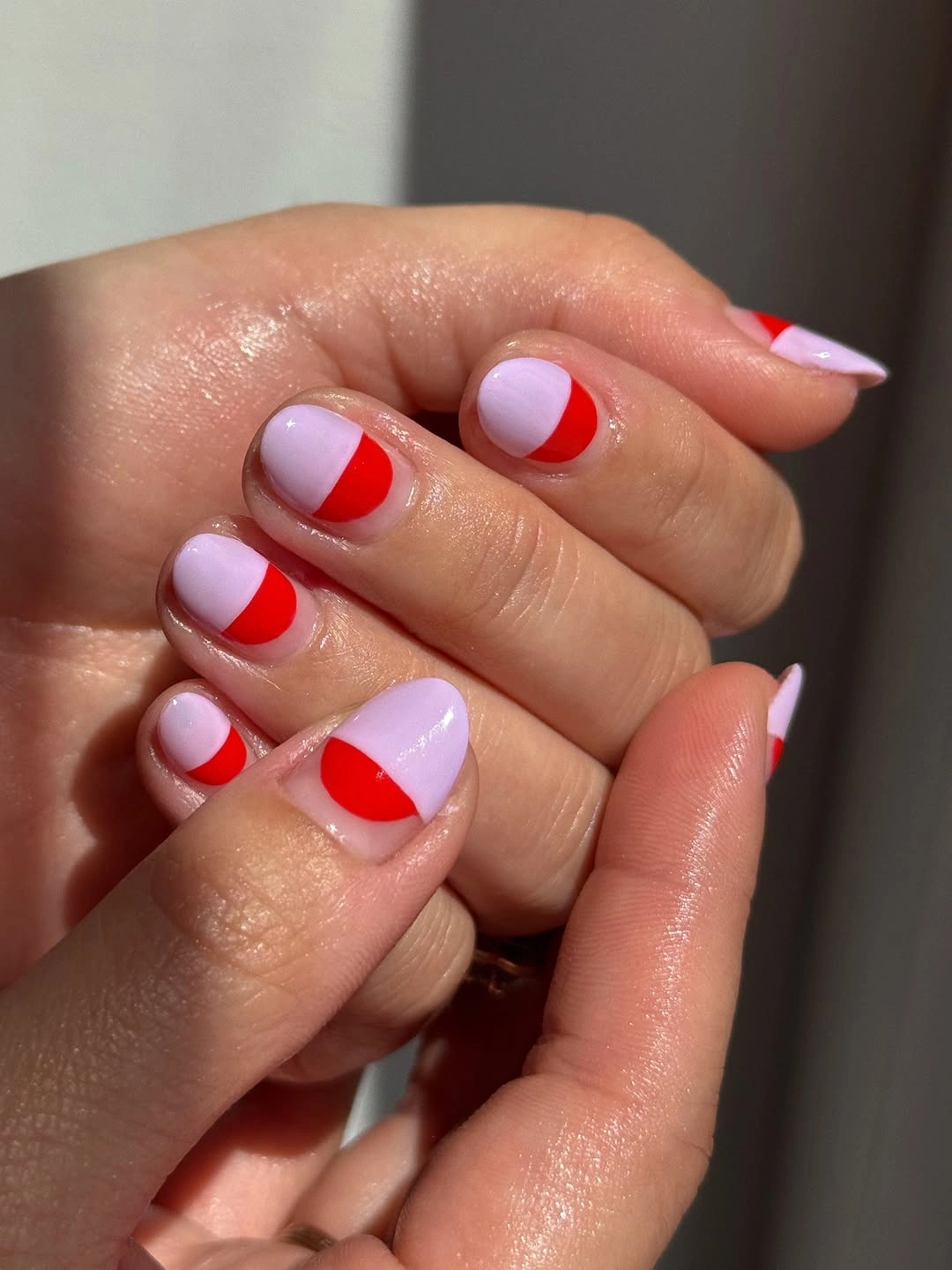 September nail designs 2026 Red And Pale Pink Nails With Rounded Color Blocks