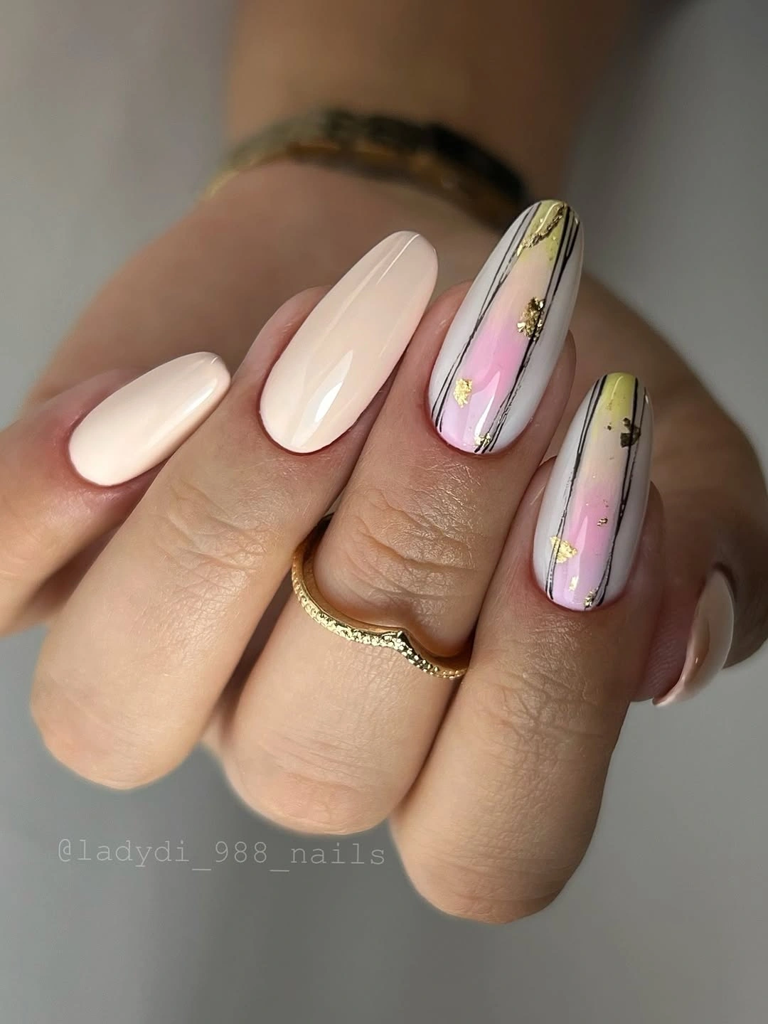 September nail designs 2026 Cream Almond Nails With Black And Gold Brush Lines
