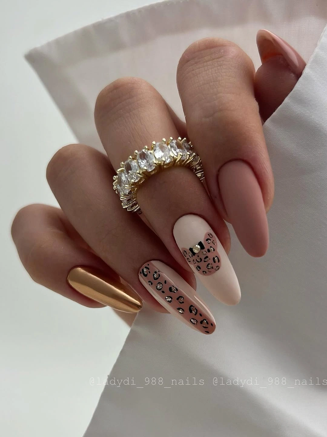 September nail designs 2026 Nude Almond Nails With Leopard And Gold Accents