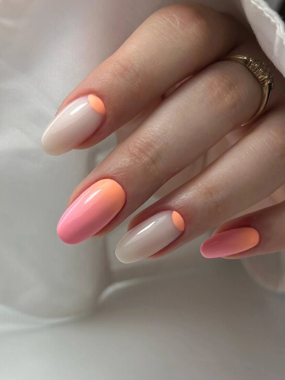 September nails color 2026 Coral Curves Over A Nude Almond Base