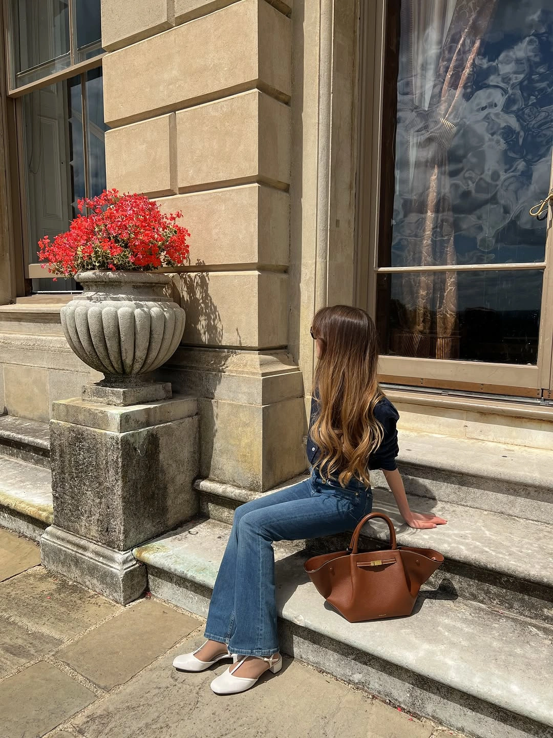 September outfits ideas 2026 Navy Top With Flared Denim And White Shoes