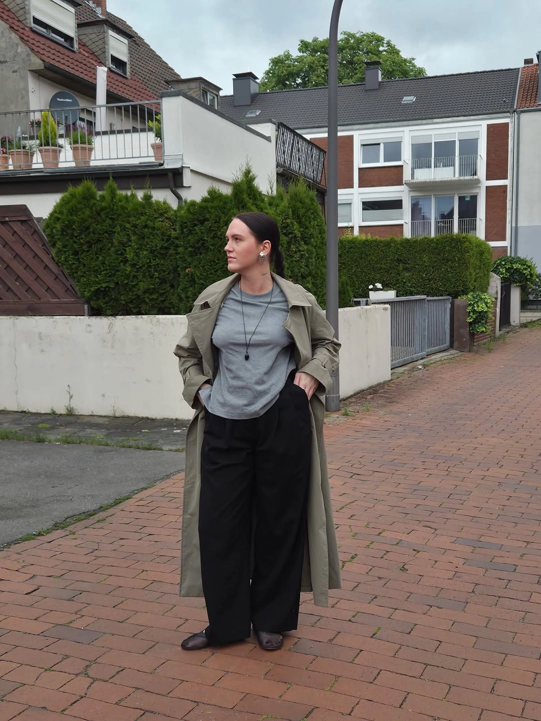 September outfits ideas 2026 Long Trench Over Gray Top And Black Trousers