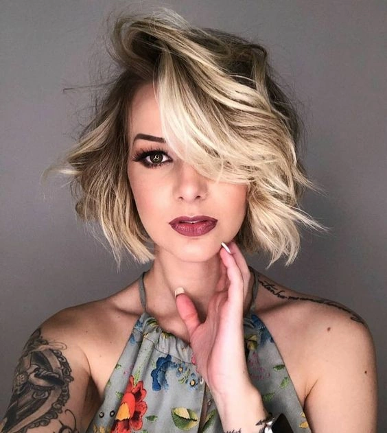 short bobbed hairstyle Blonde Tousled Bob With Side-Swept Drama