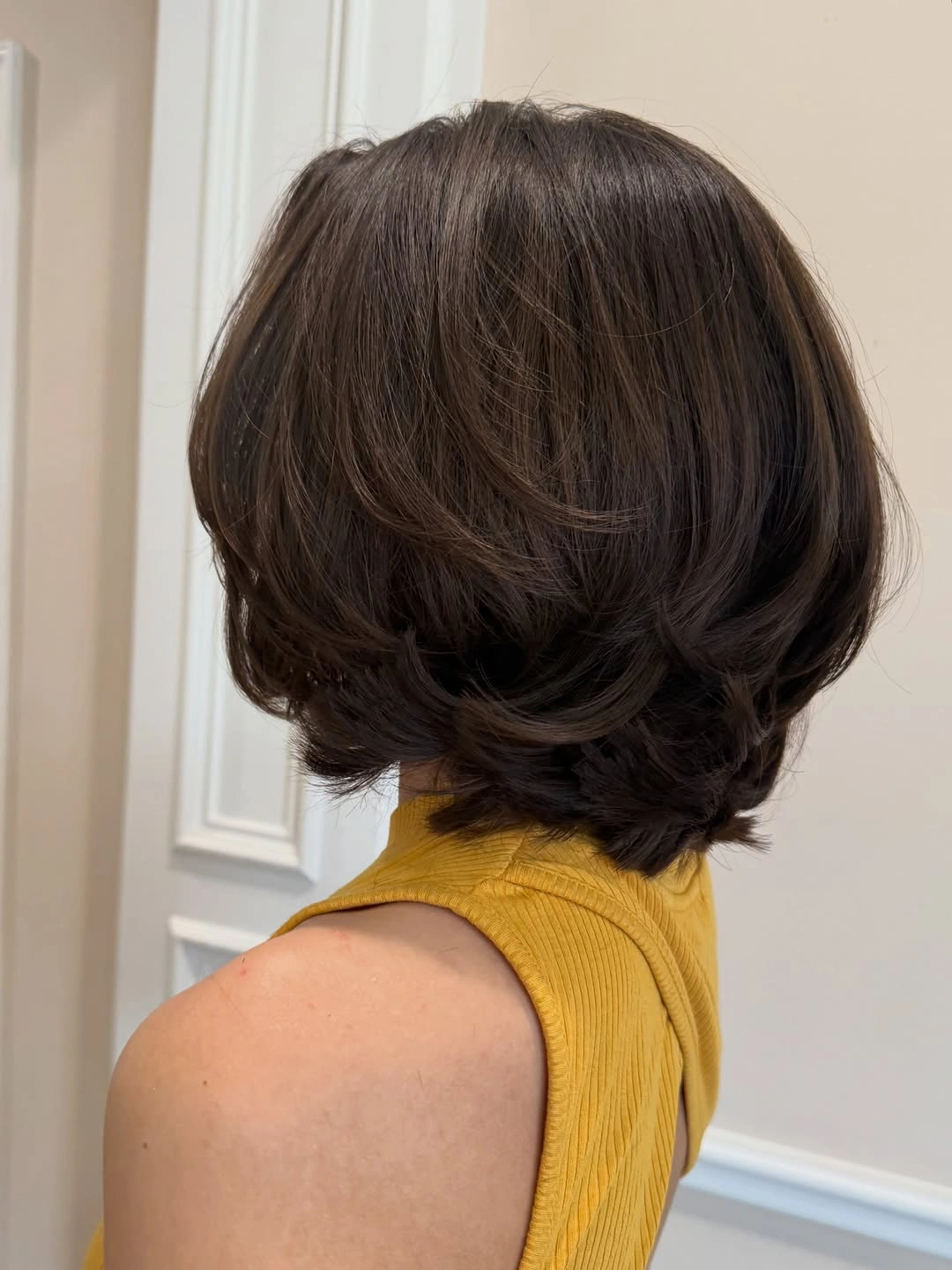 short bobbed hairstyle Feathered Brown Bob With Soft Back Volume
