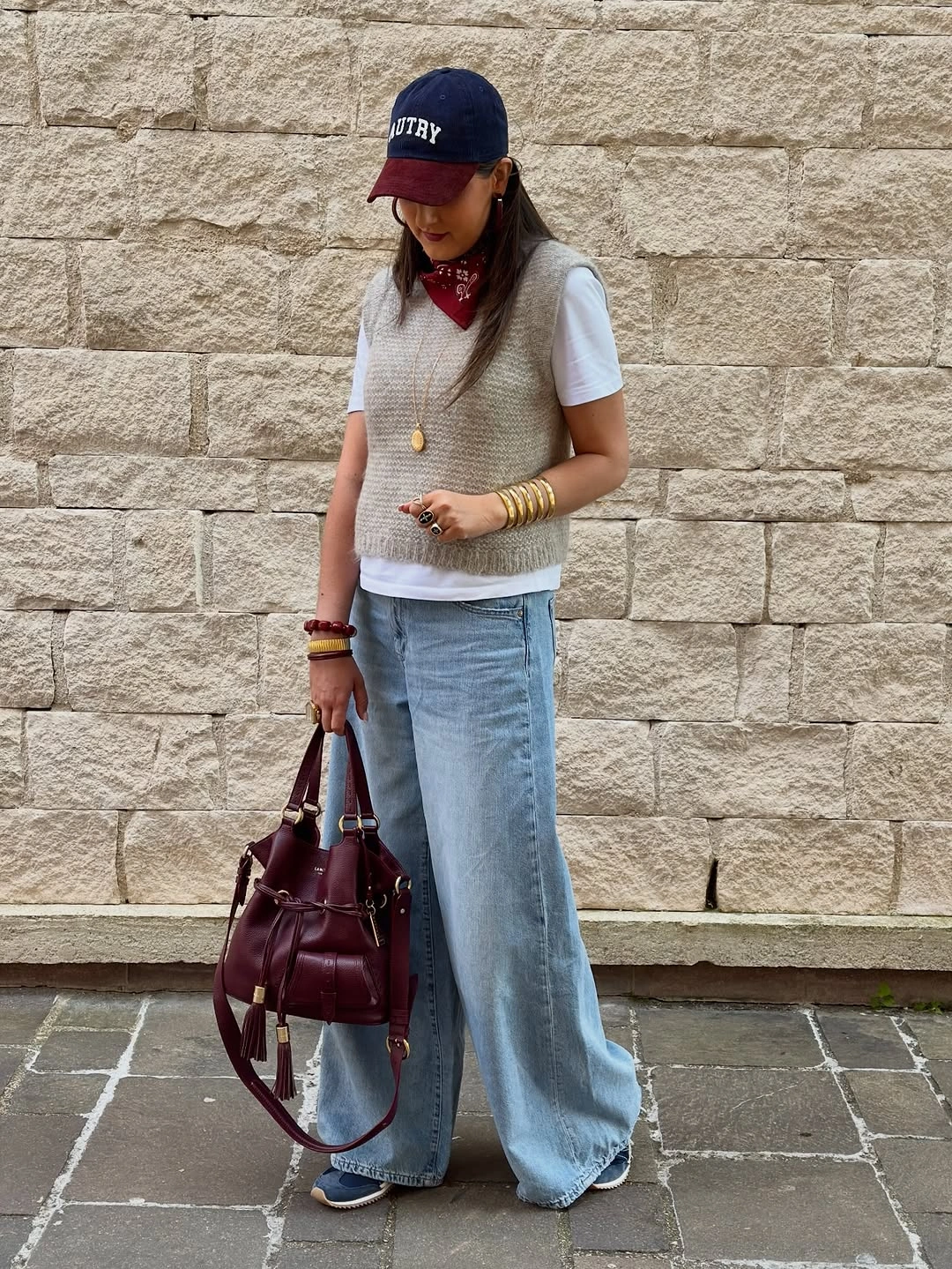 wide leg jeans outfit fall 2026 Cozy Knit Vest Styling With Light Wash Wide-Leg Jeans
