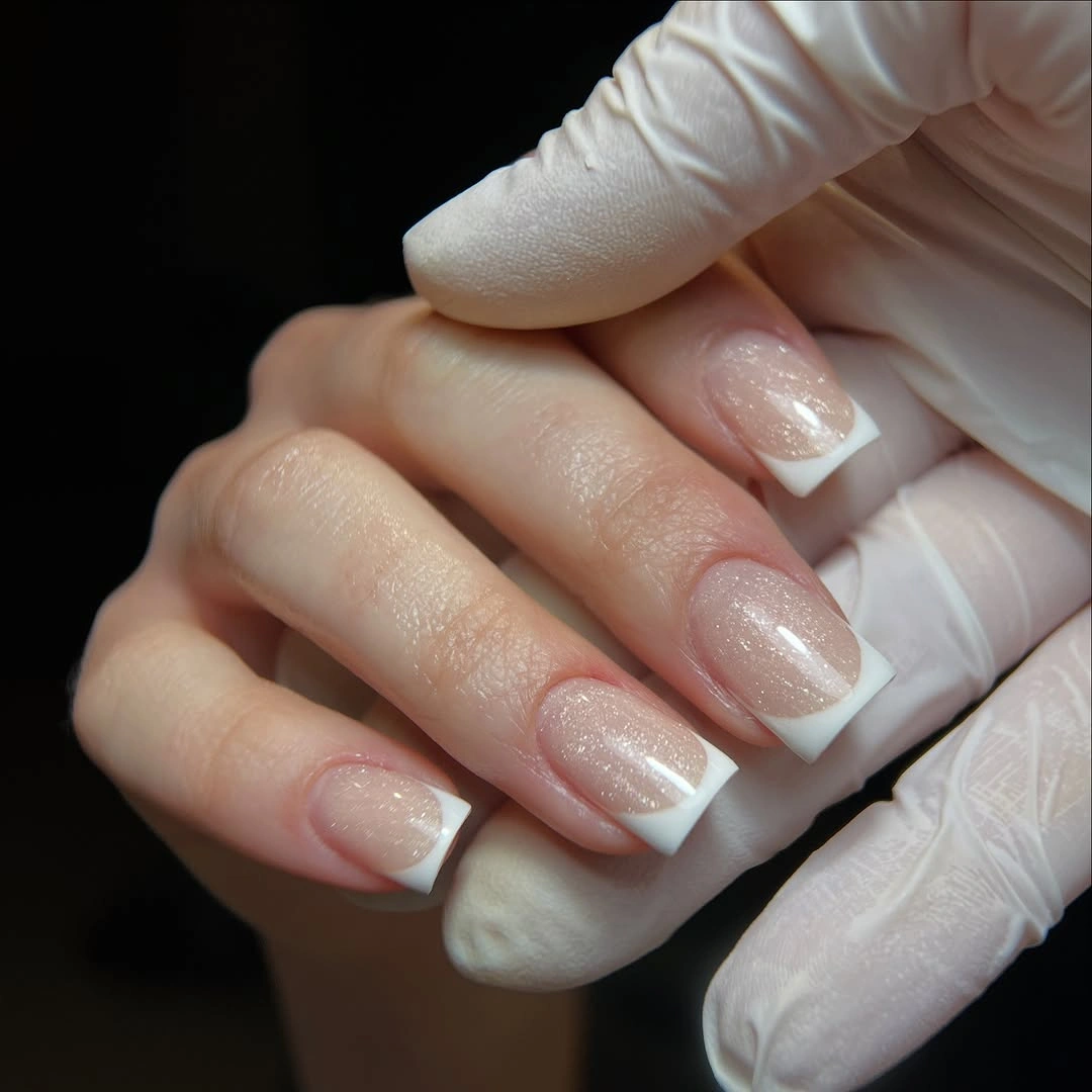 Short nude nails with crisp white French tips