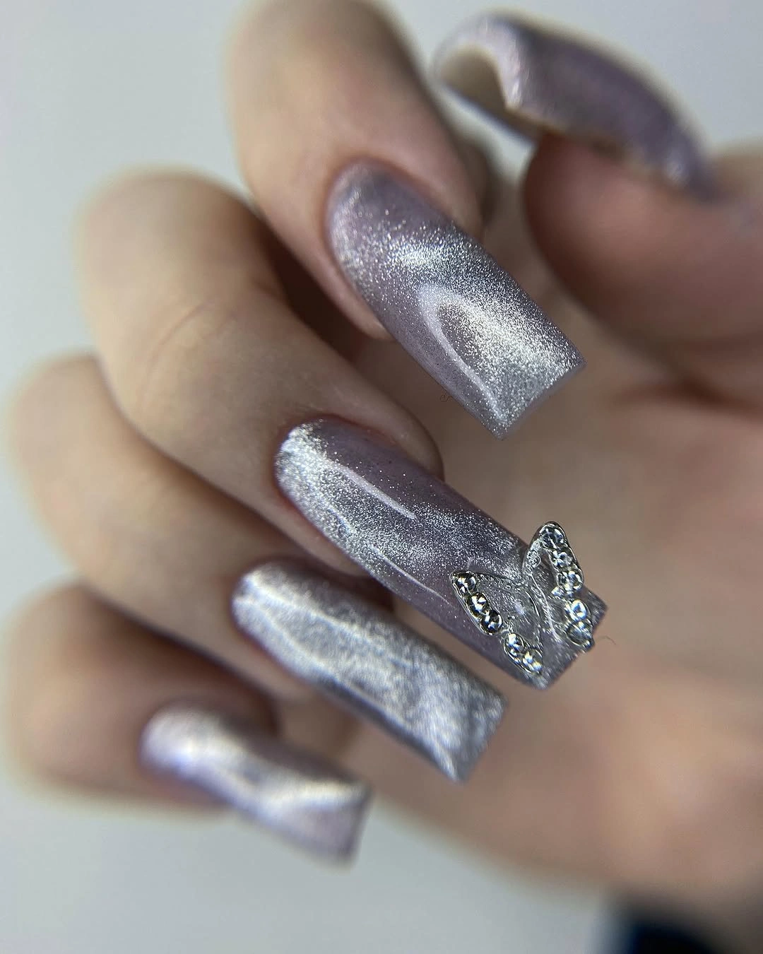 Long reflective silver square nails with one accent