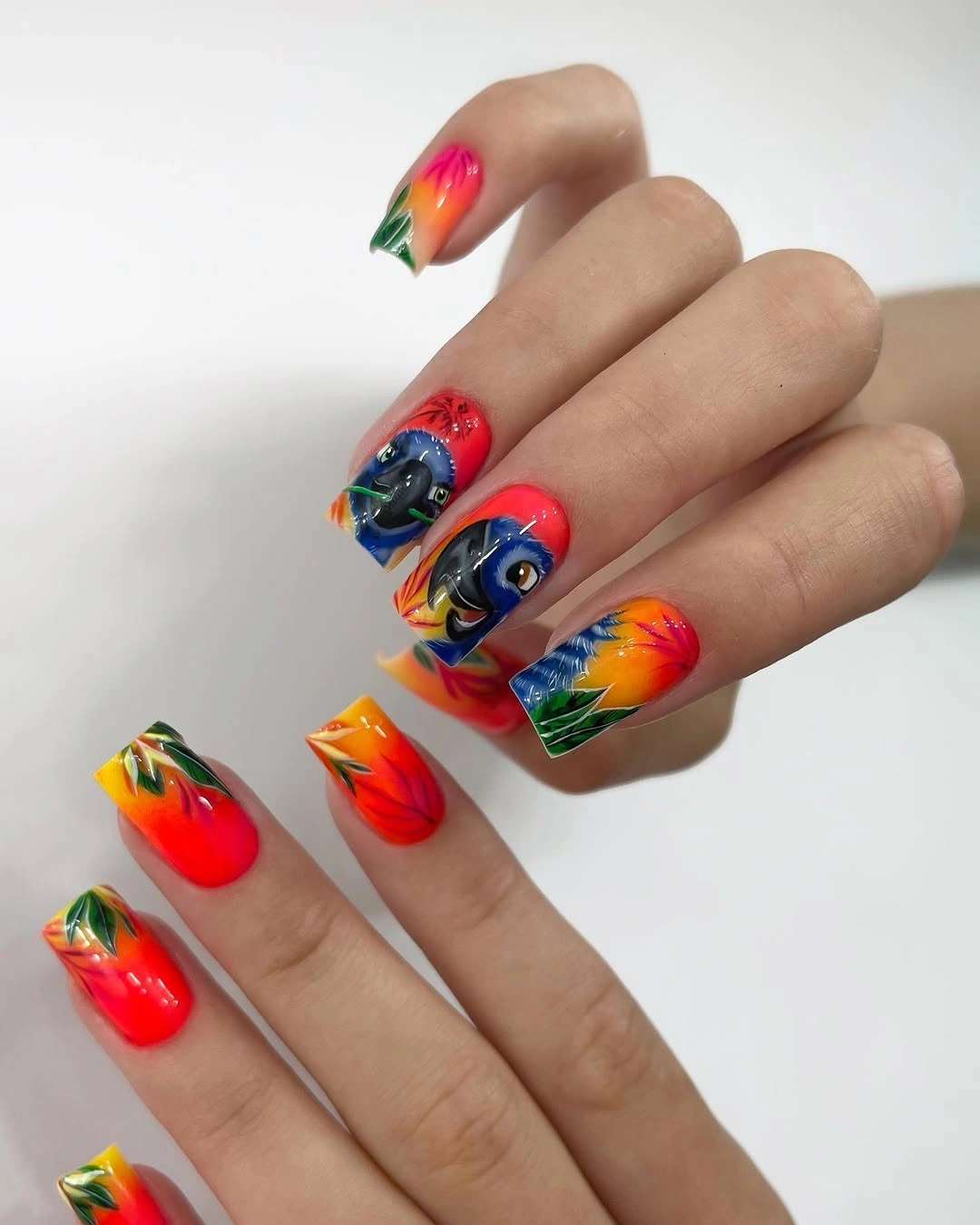 Long nails with saturated orange blue and green color blocks
