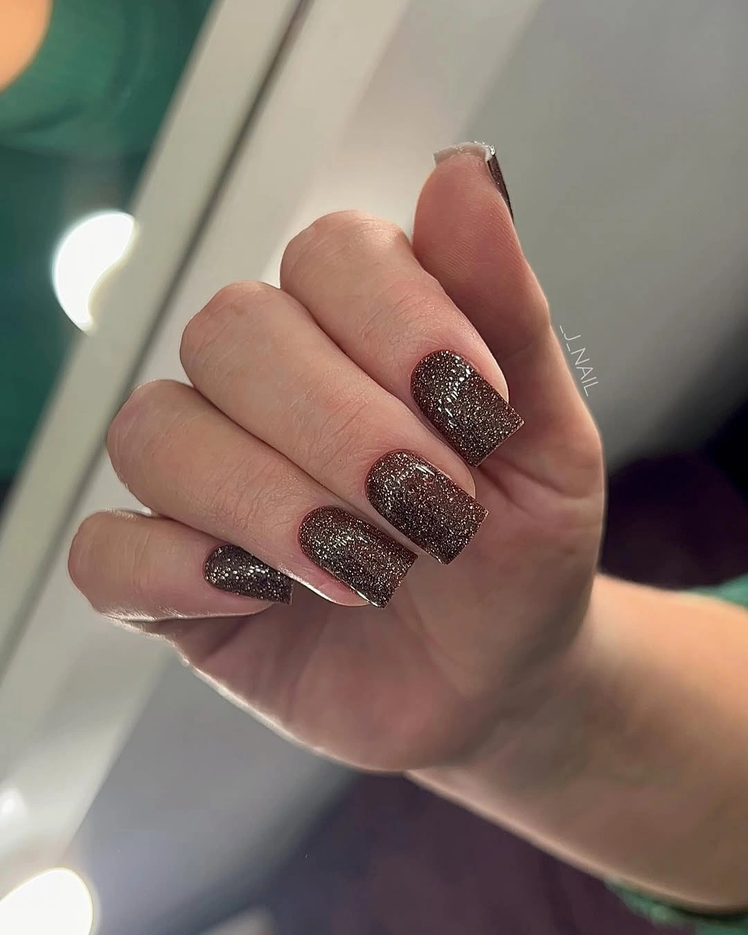 short square nails in glossy deep plum brown