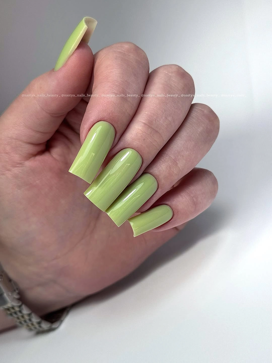 Very long vivid lime green tapered nails in a solid set