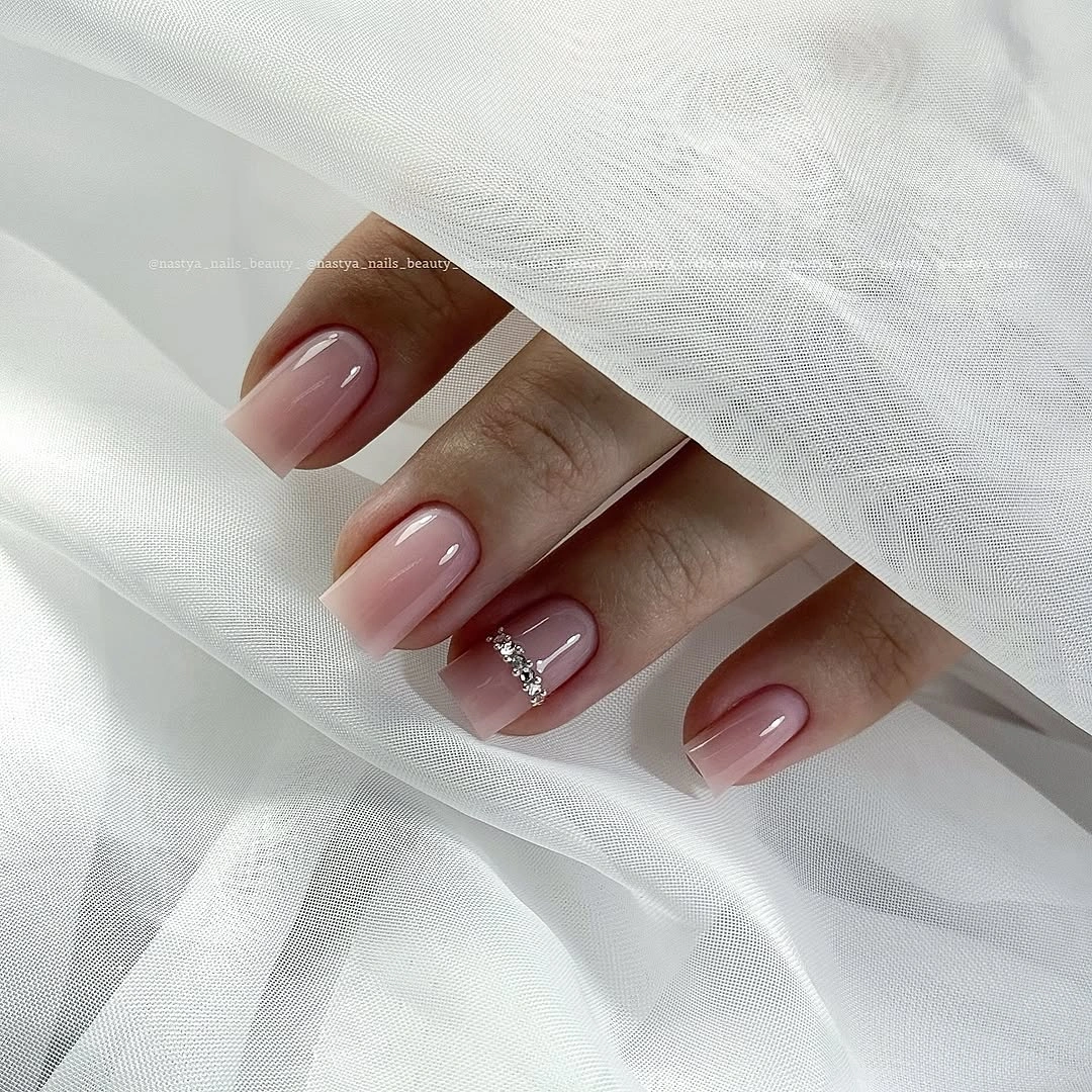 Short mauve nails with one tiny reflective accent detail