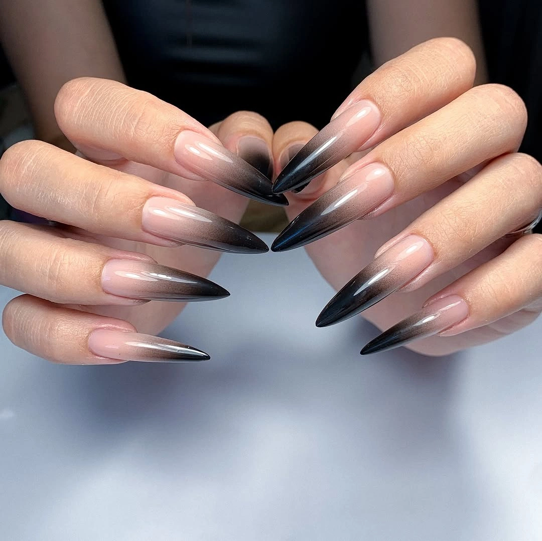 Long stiletto nails with smoky black tips