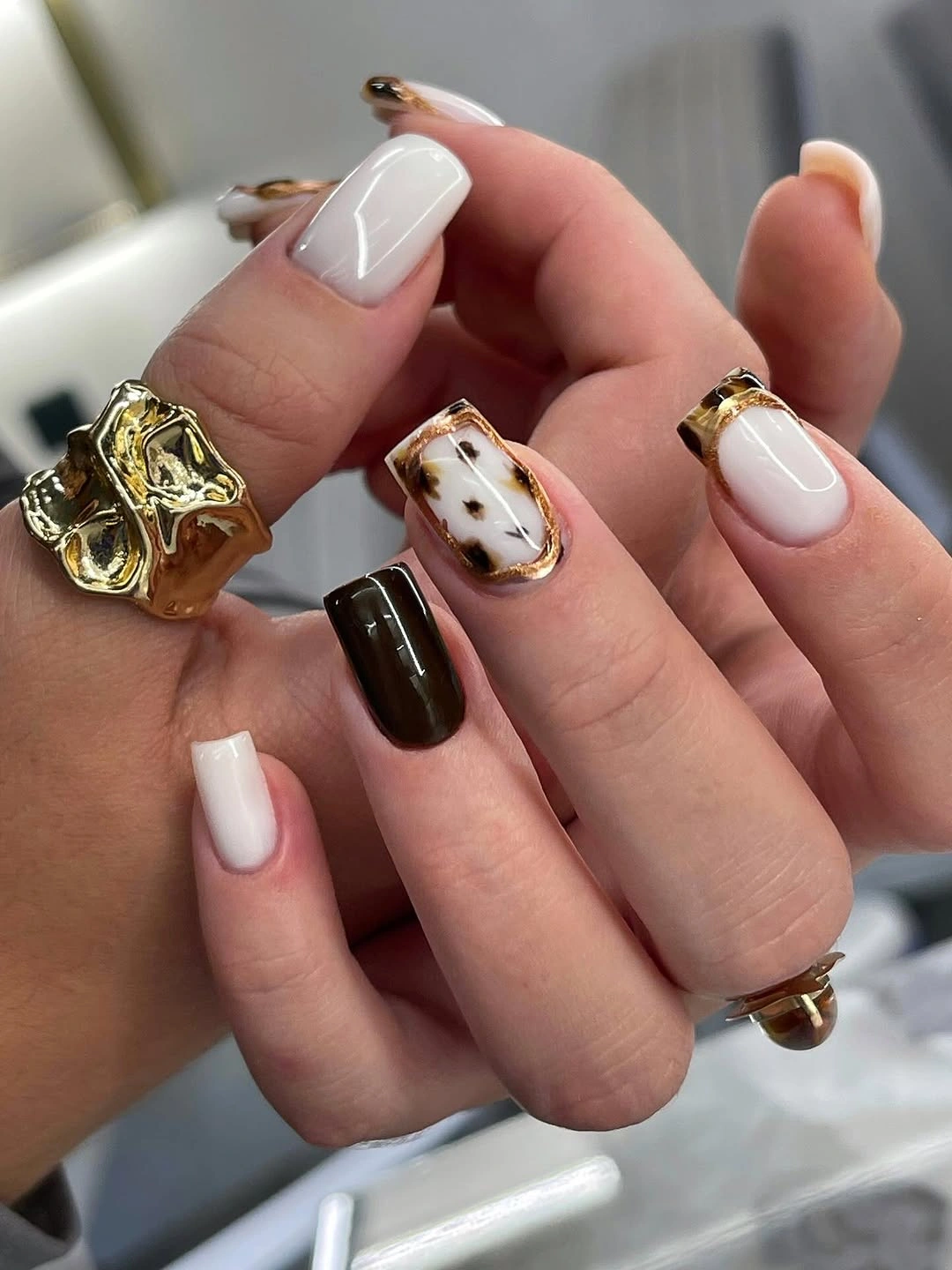 Cream and brown short square nails with gold edges