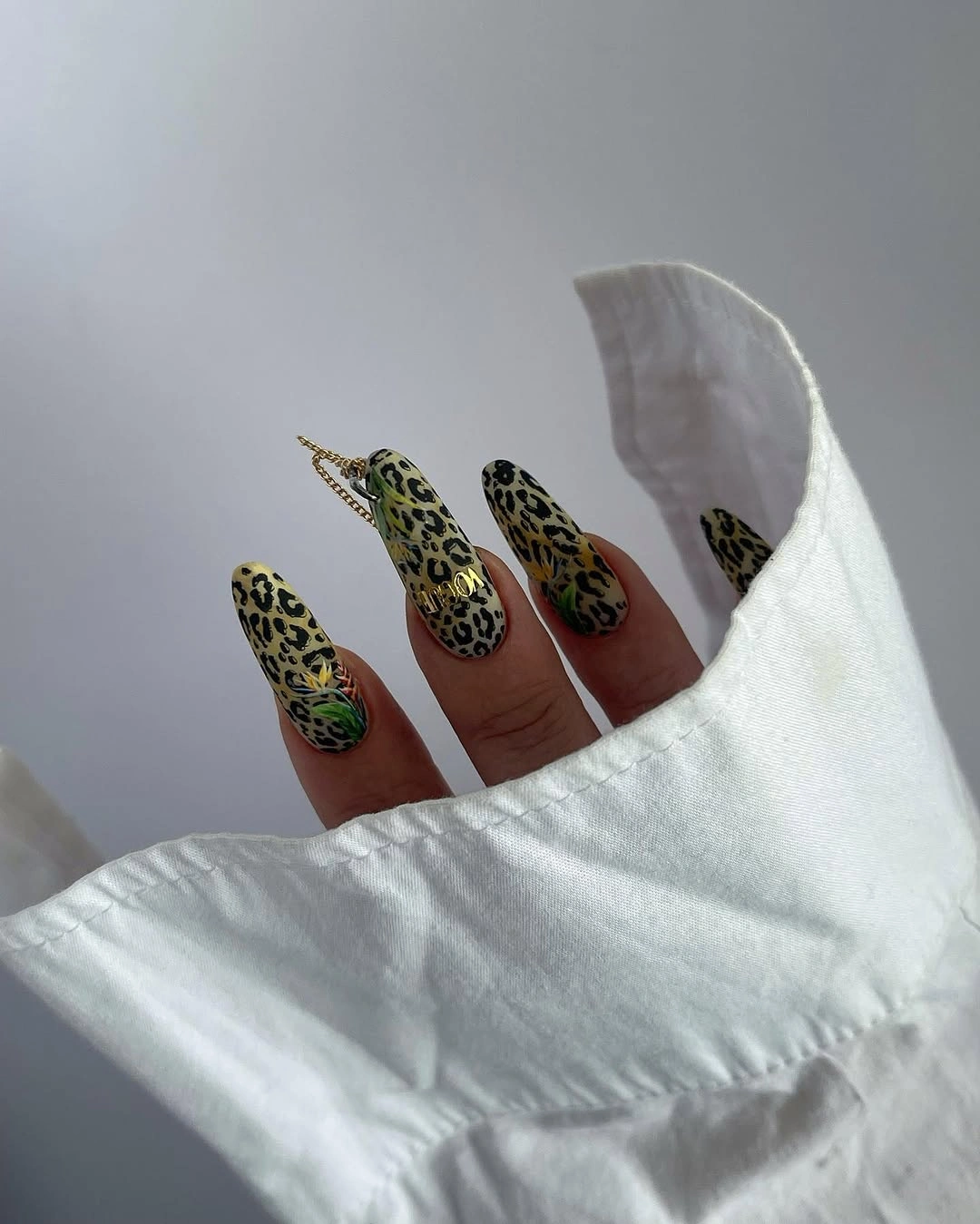 Spotted almond nails with tiny floral accents