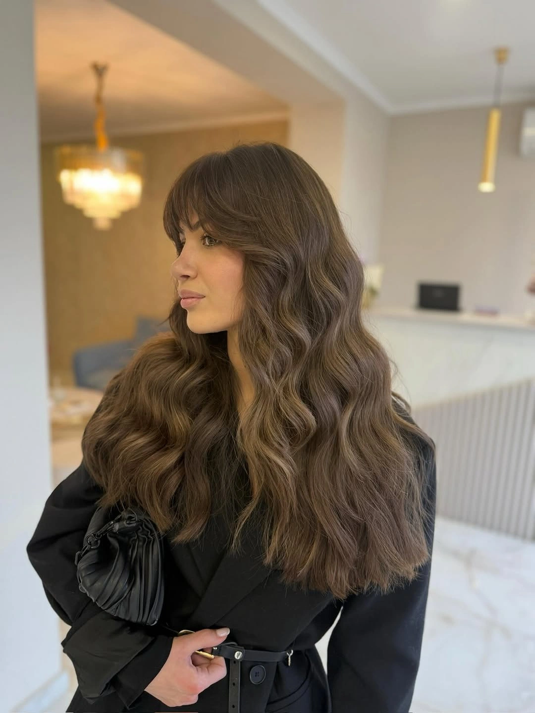 Long muted brown and taupe hair in relaxed soft waves