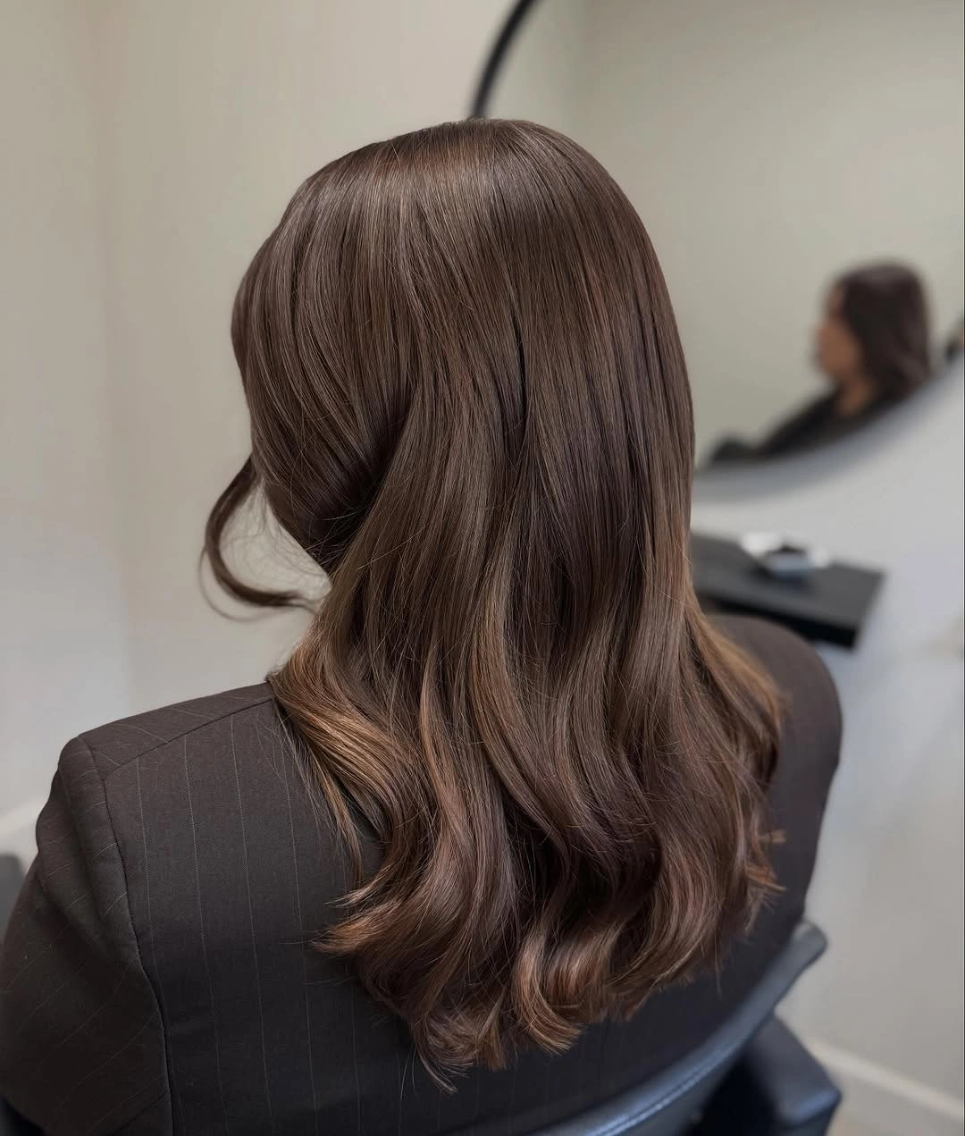 Smooth warm brown hair with a softly rounded lower edge