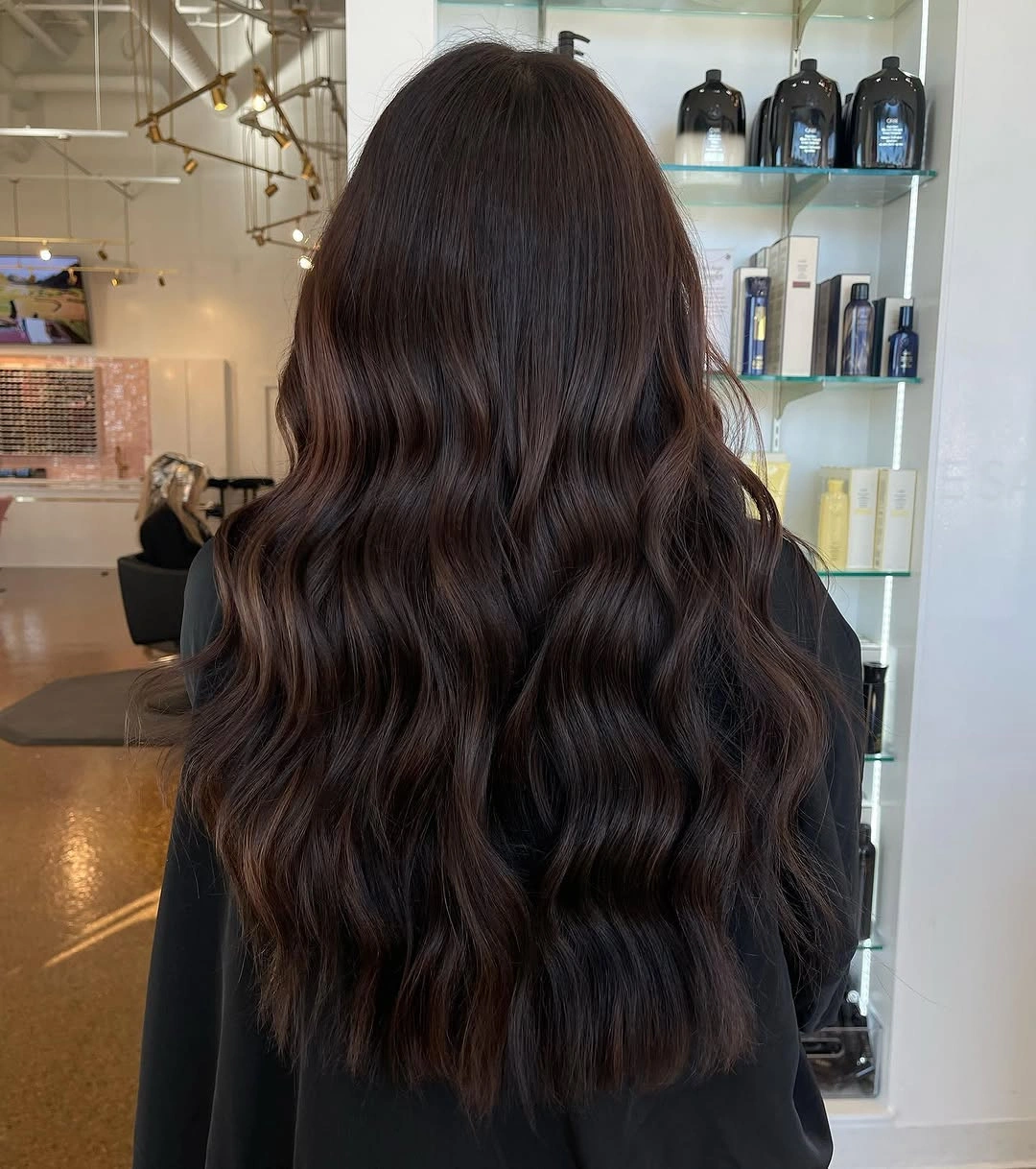 Long deep brunette hair in smooth wide loose waves