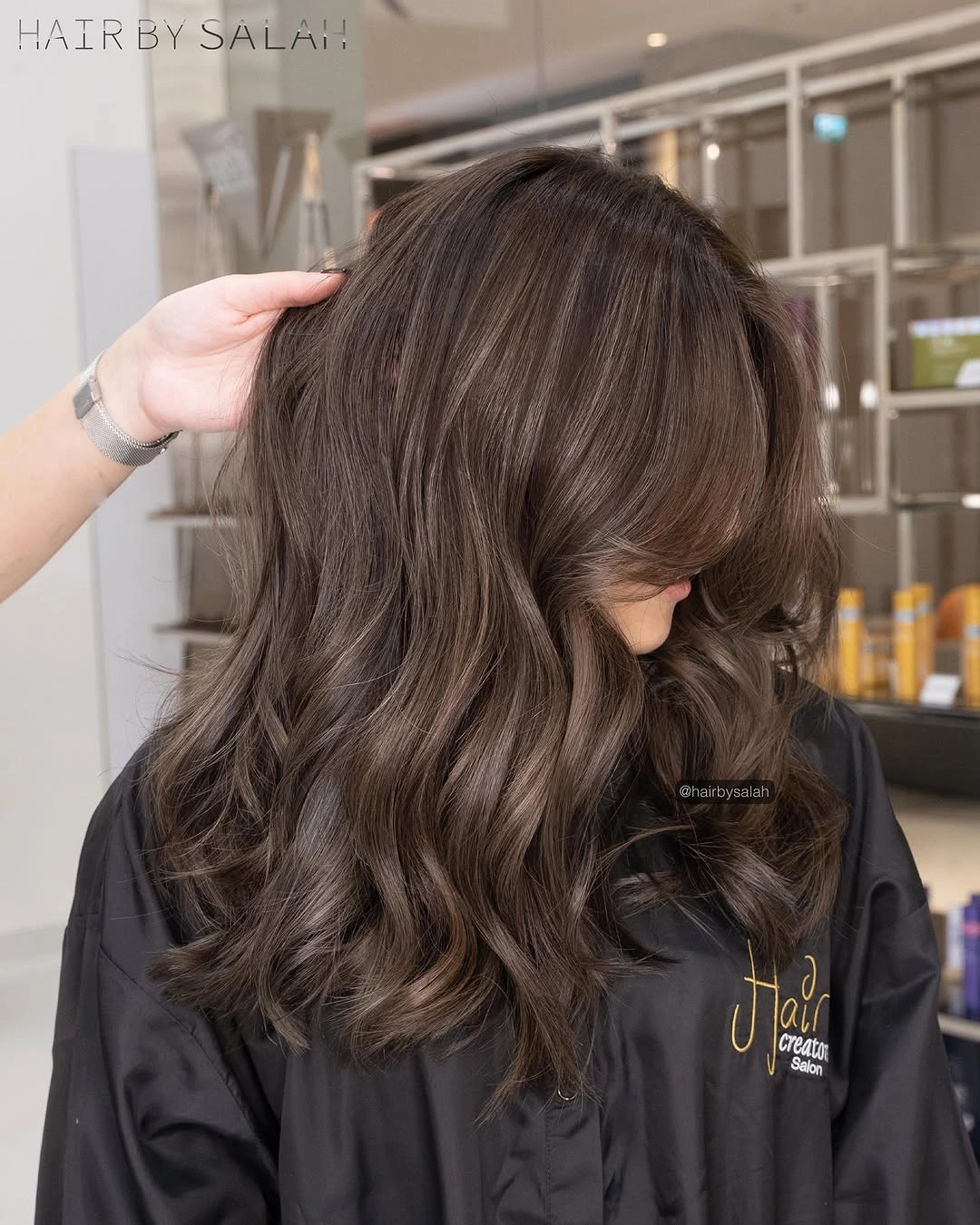 Long mocha brown waves with soft lighter face framing