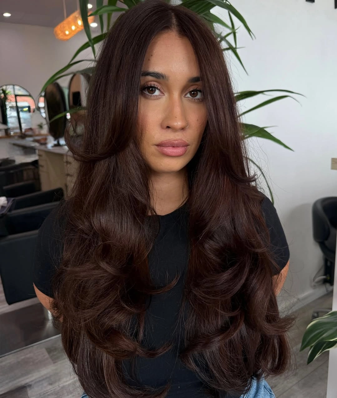 Long plum brown hair with smooth bends through the ends