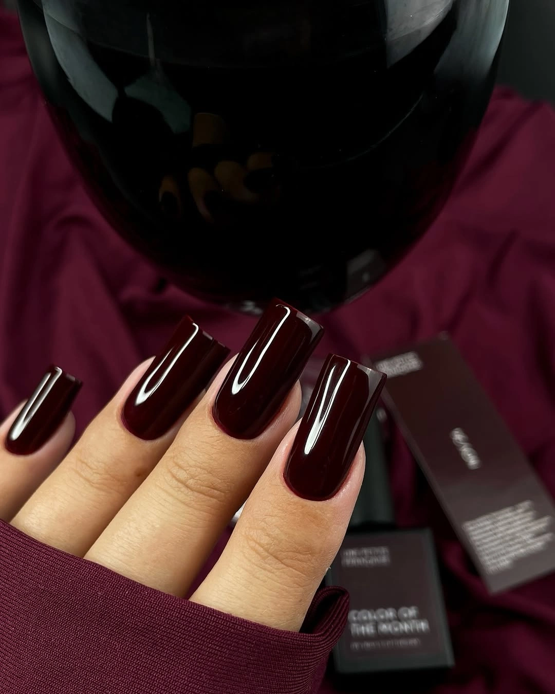 Long coffin nails in glossy deep burgundy with bright highlights