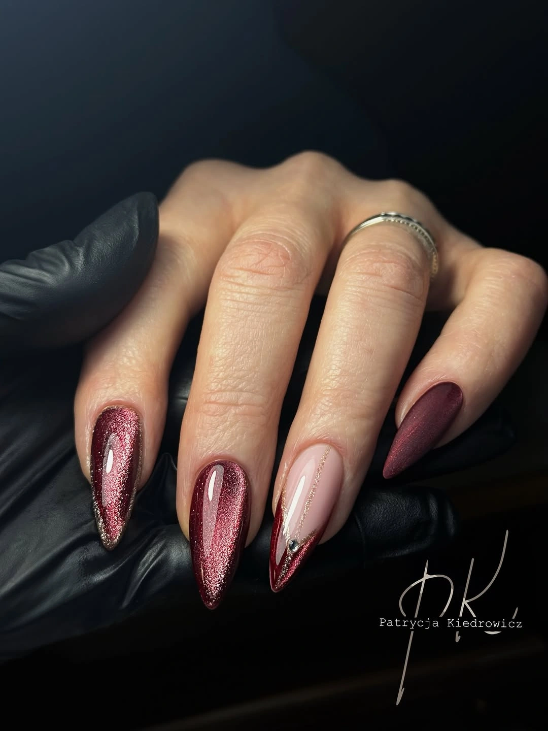 Long almond nails with reflective wine color and nude pink accents