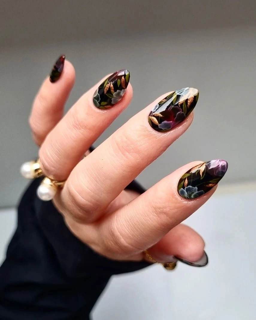 Dark almond nails with muted green burgundy and cream color patches