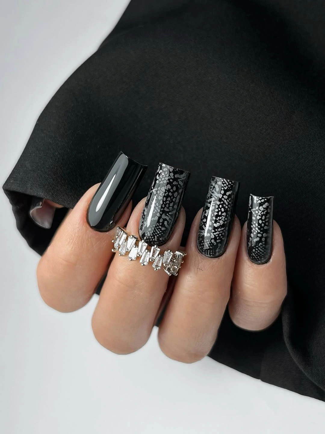 Long black square nails with dense silver lace-like texture