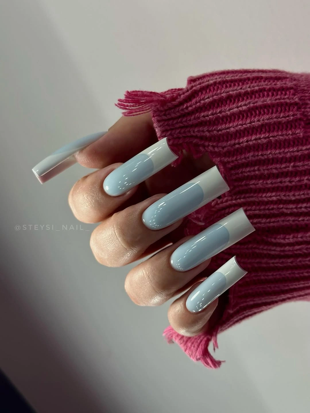 Long icy blue square nails with bright white French tips