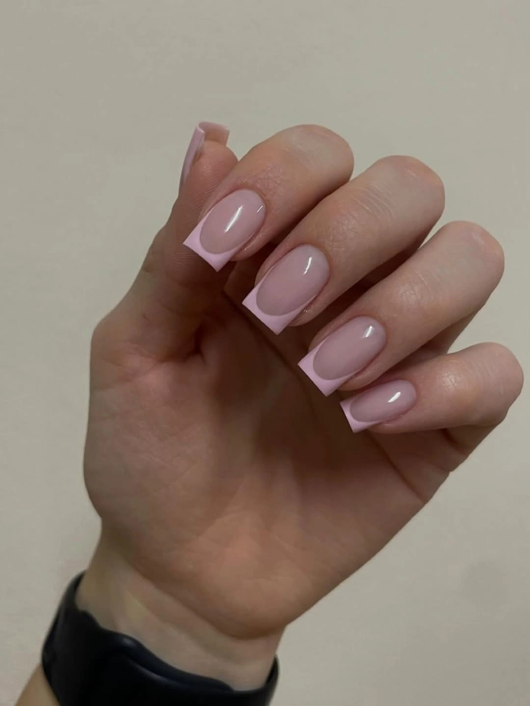 Short pale pink square nails with narrow white French tips