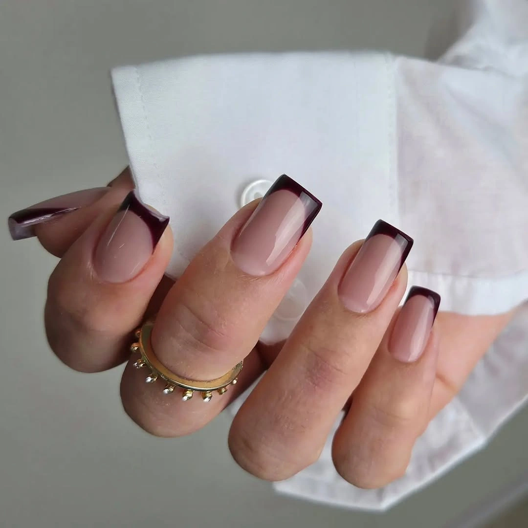 Long pink square nails with deep brown French tips