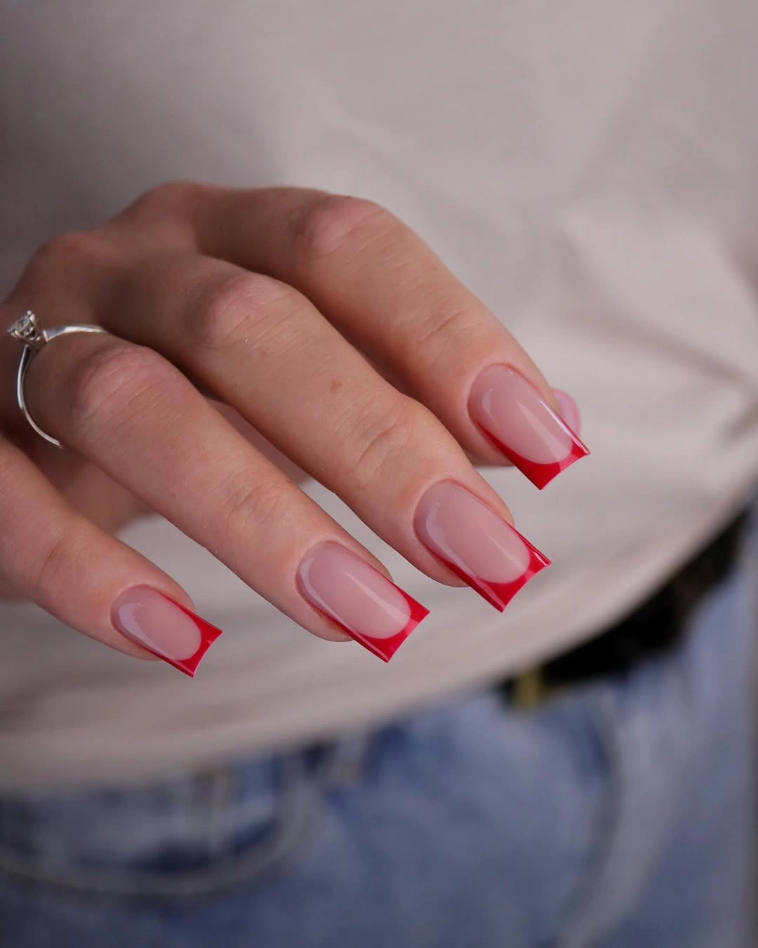 Long nude coffin nails with vivid red French outlines