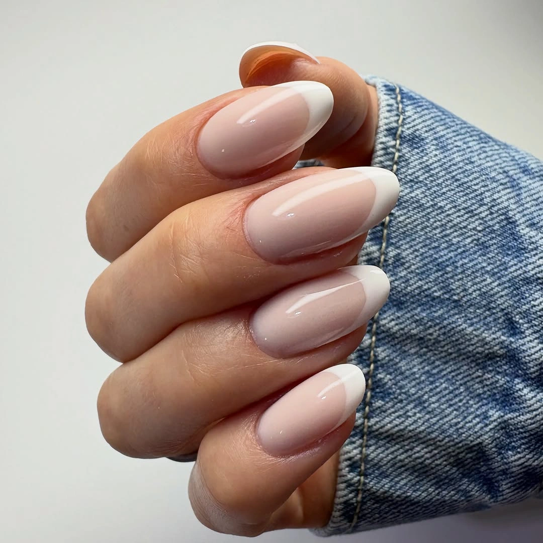 Milky pink almond nails with soft white French ends