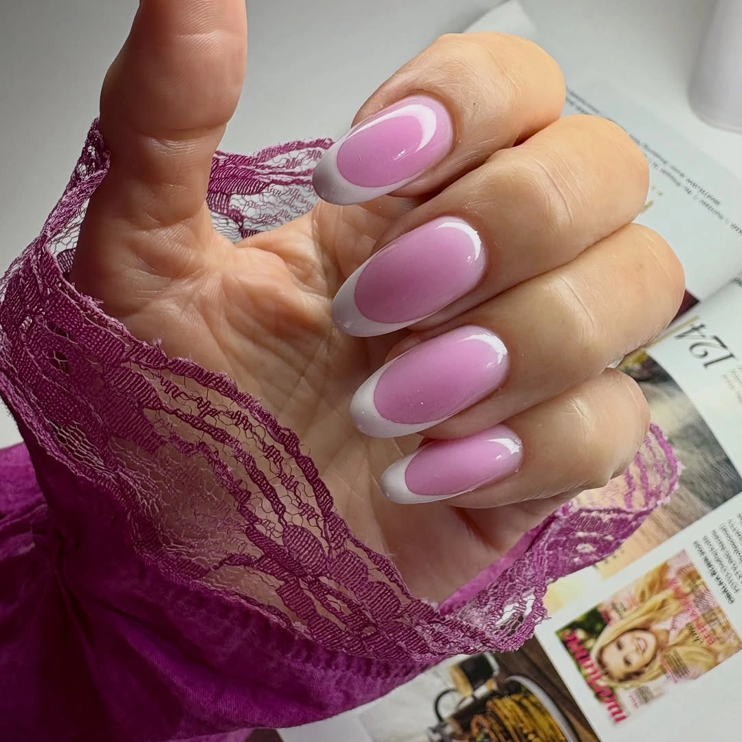 Long glossy oval nails in translucent lilac pink