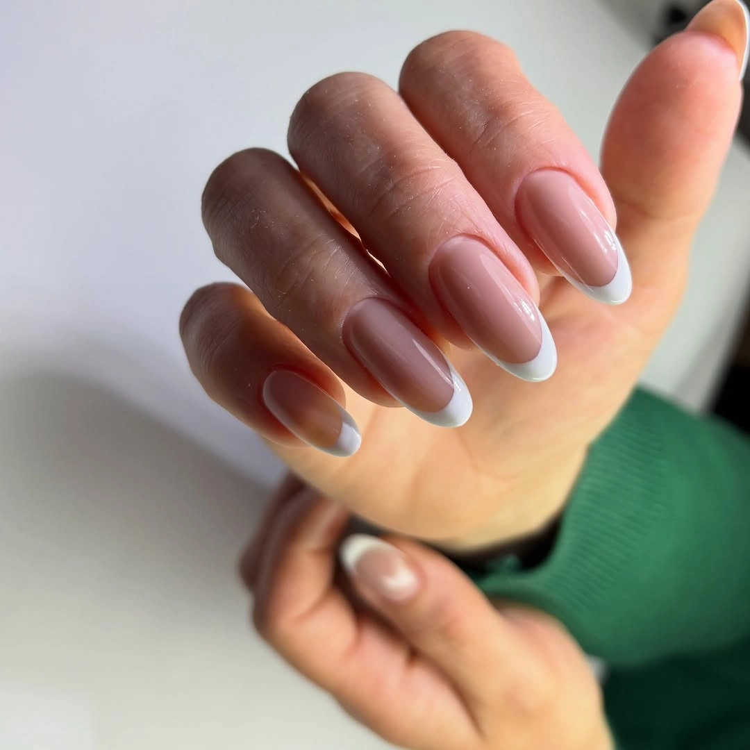 Pink almond nails with pale blue and white French tips