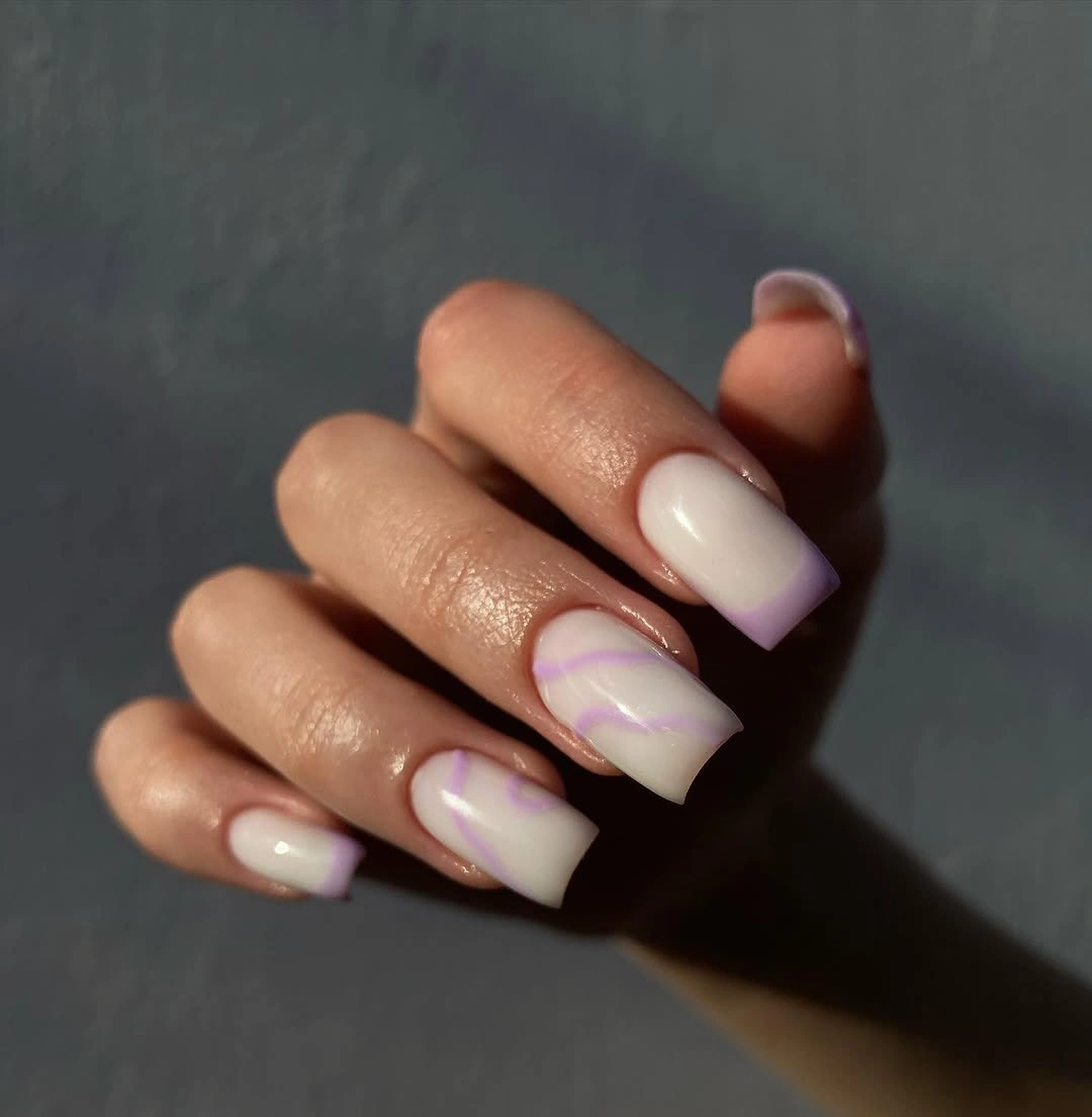 Creamy nails with delicate pink abstract curved lines