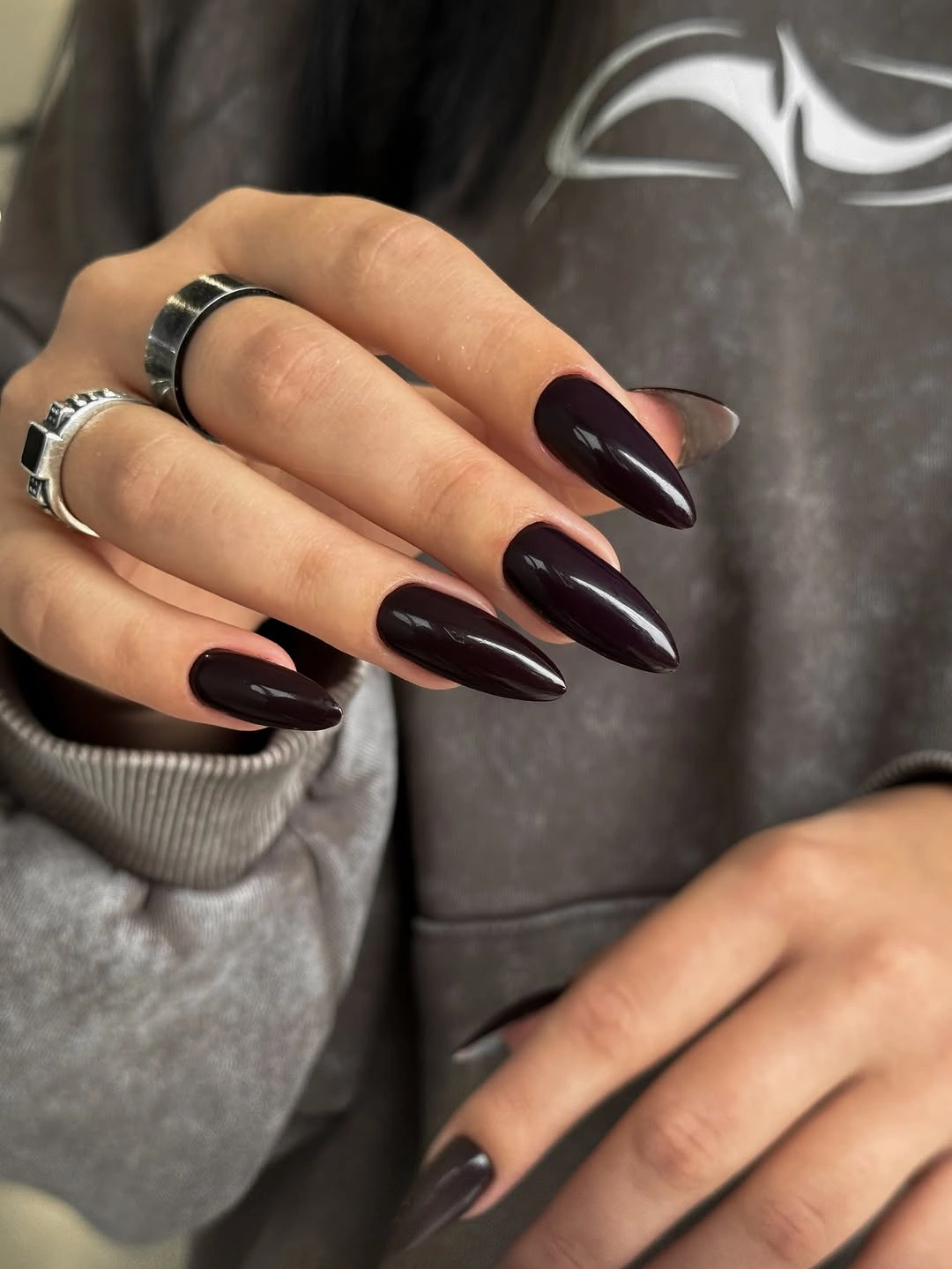 Medium-long glossy chocolate-brown almond nails