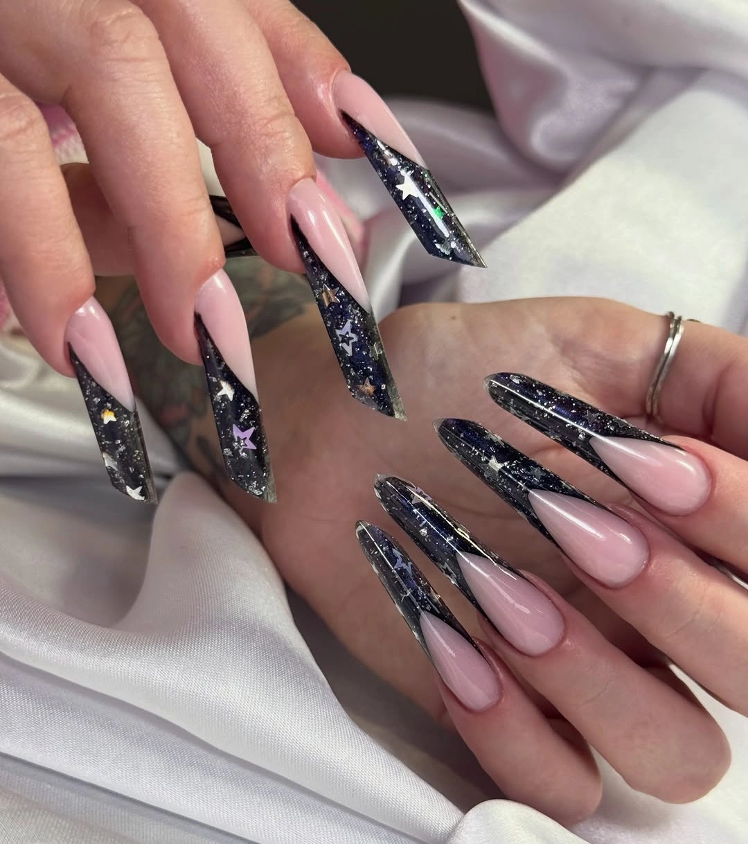 Long blush stiletto nails with dark glitter triangular tips