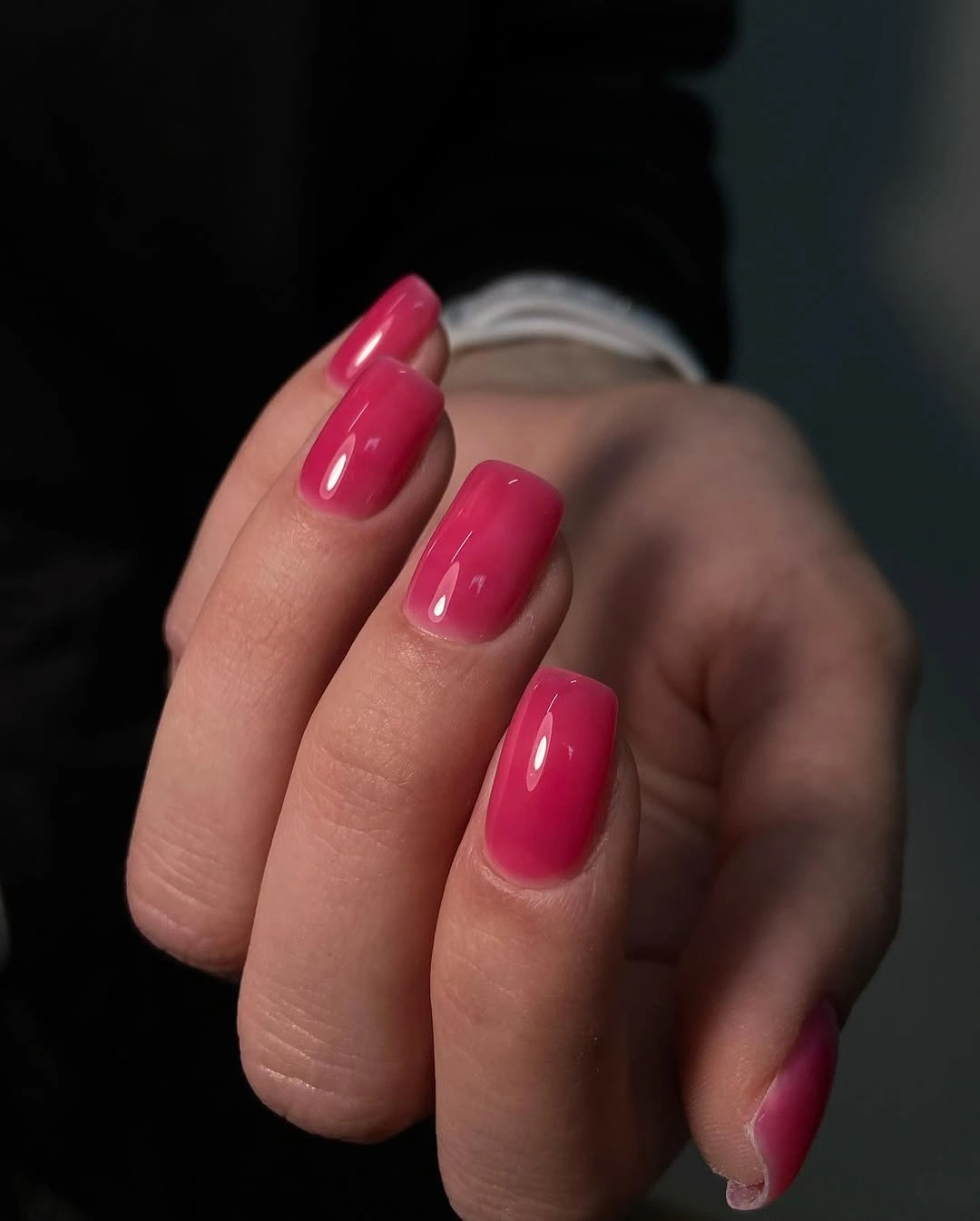 Short rounded glossy berry pink nails