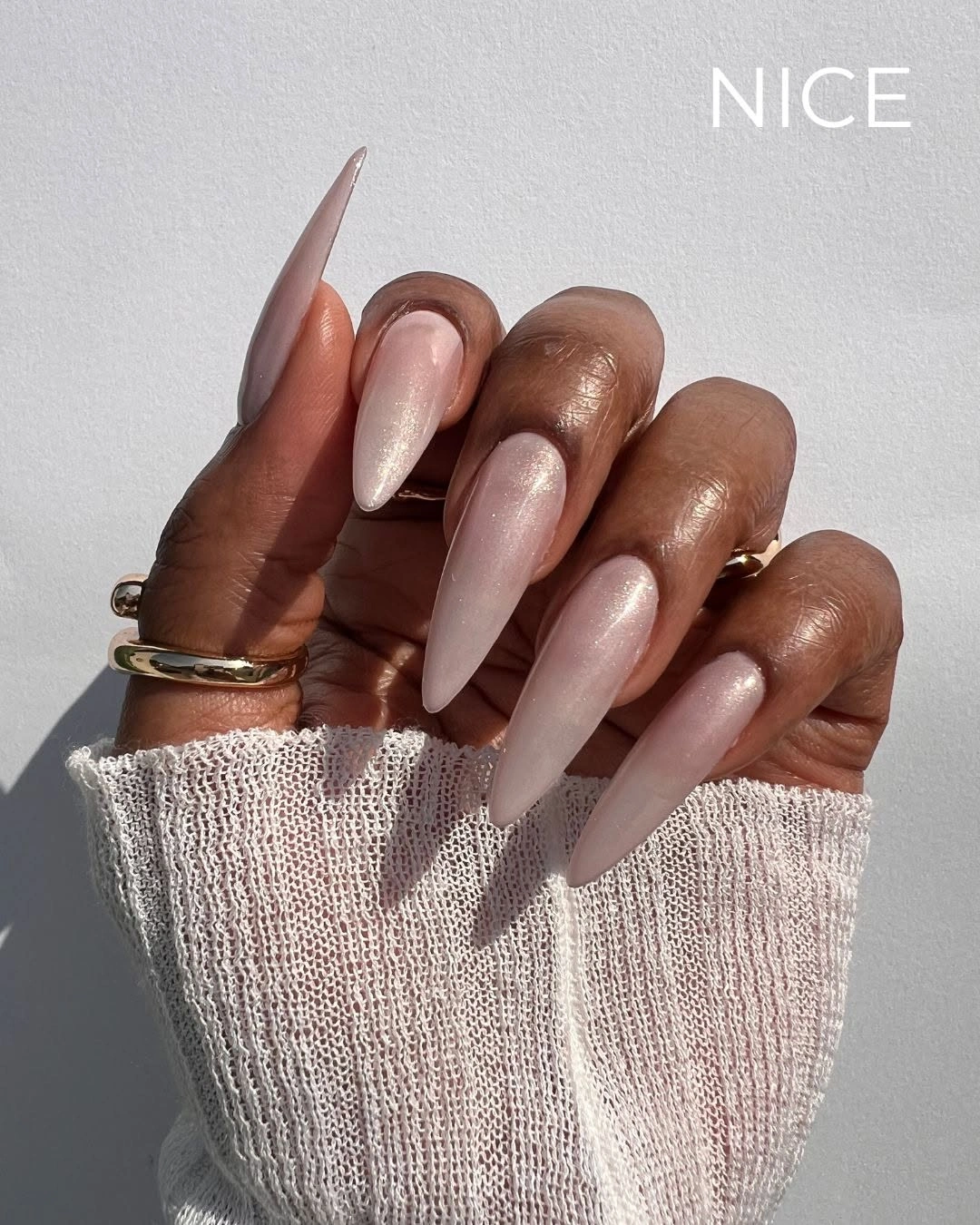 Long stiletto pearly pale pink nails