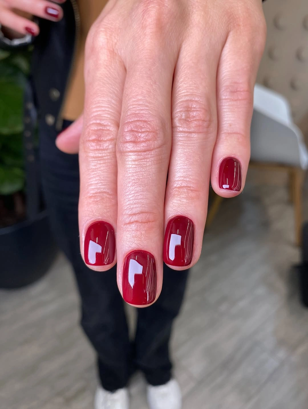 Short rounded-square glossy cherry-red nails