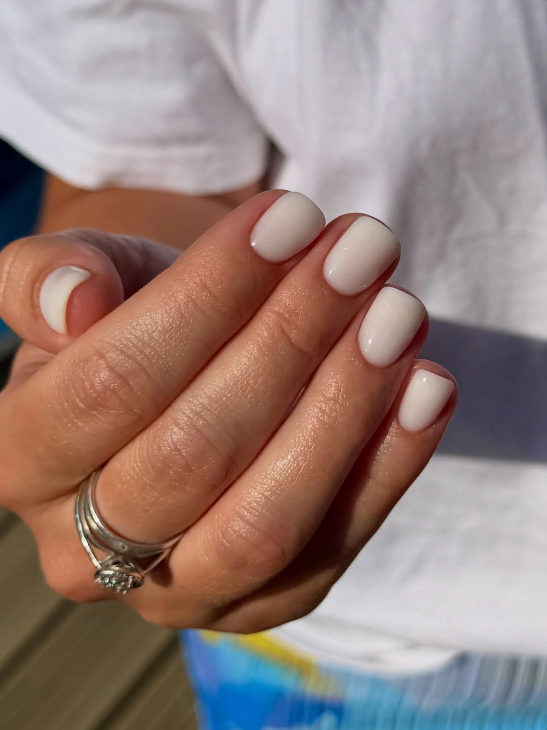 Short rounded-square glossy creamy ivory nails